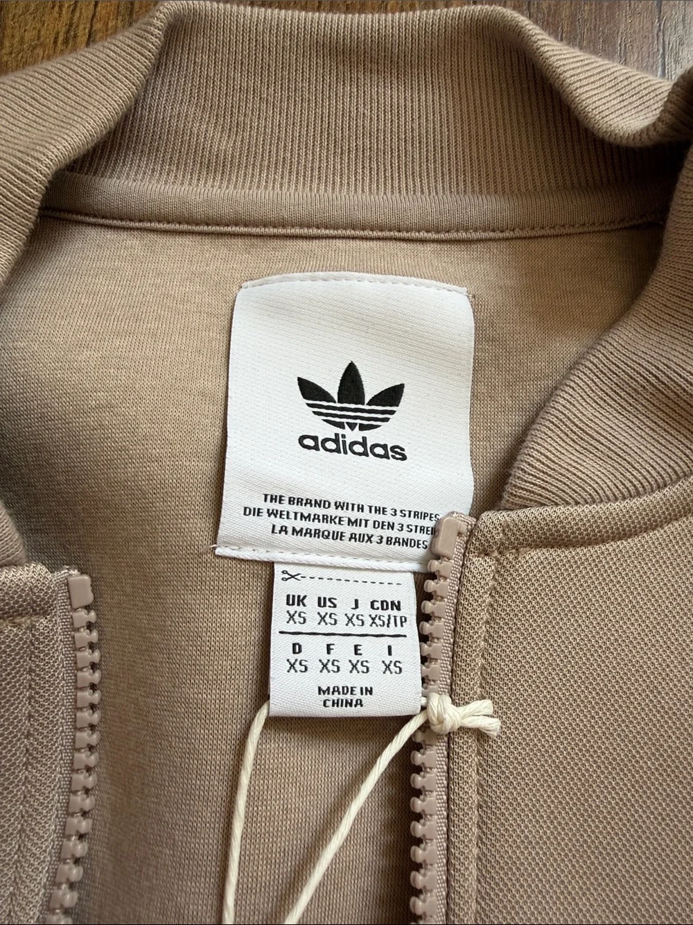 adidas beige bomber jacket with front flap pockets